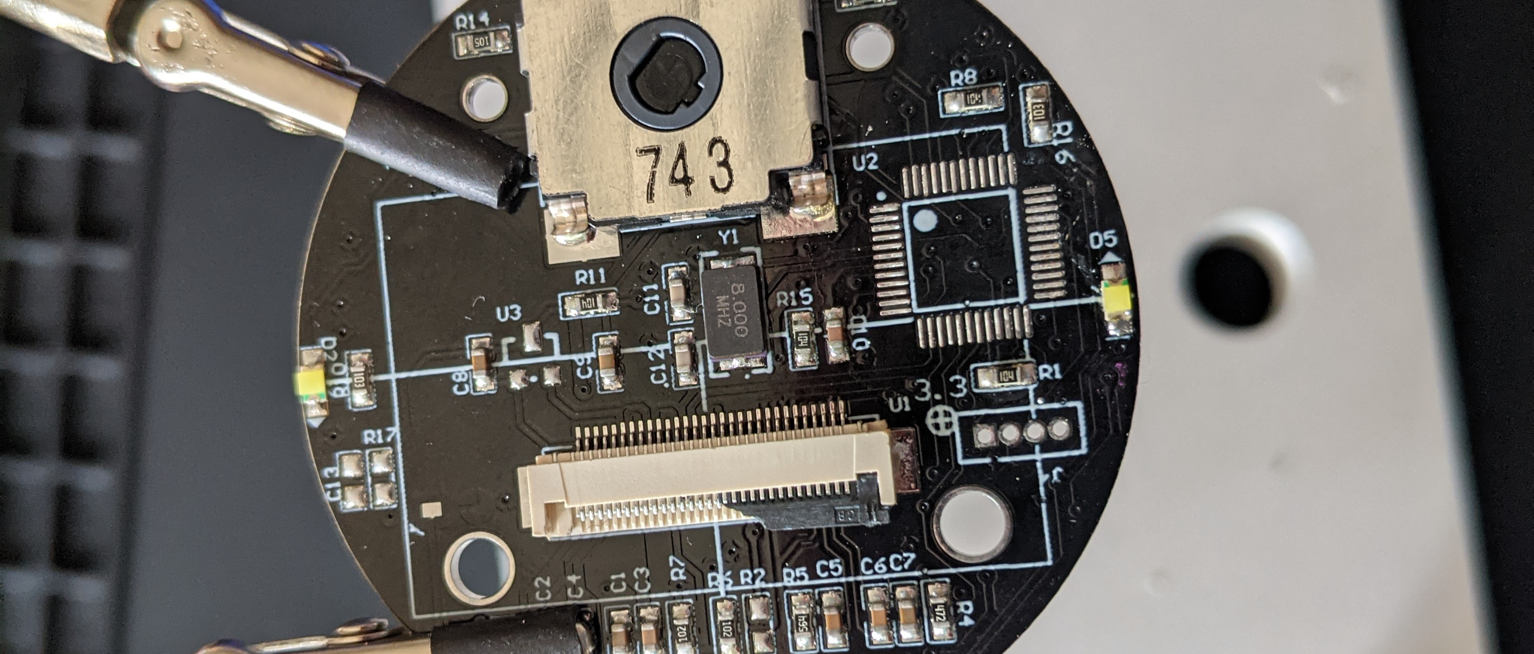 Photo of the board, the pads having been cleaned of excess solder and resin